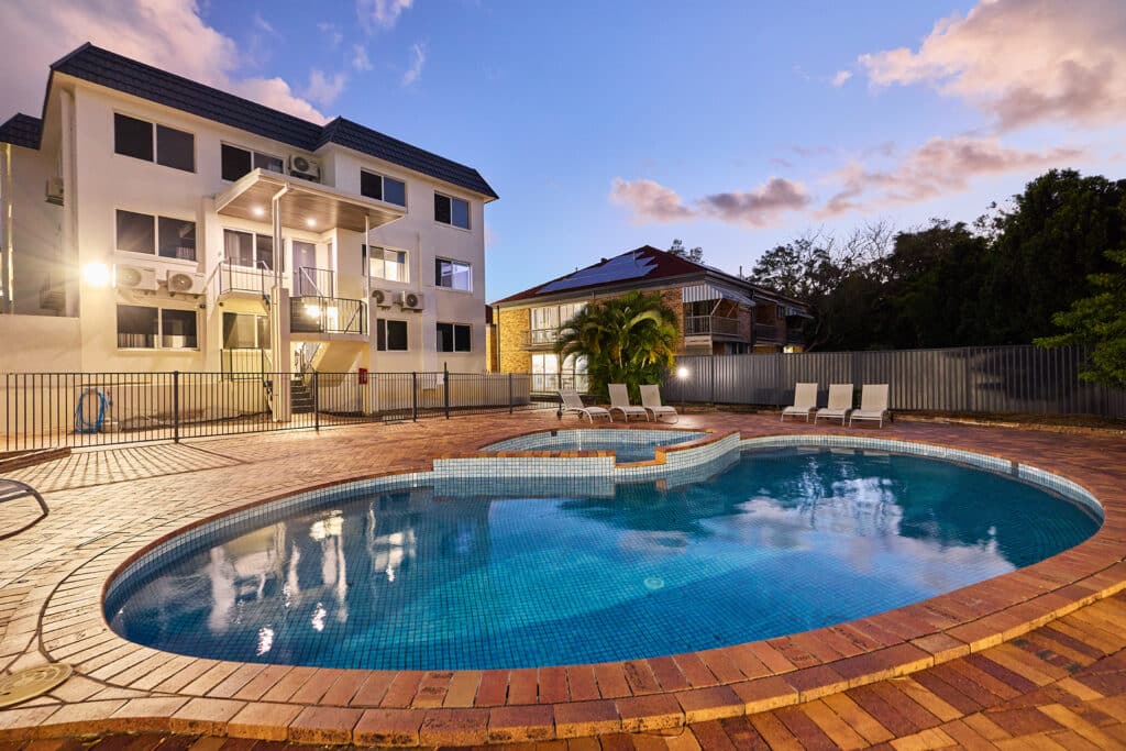 Apartment building inground pool area facilities