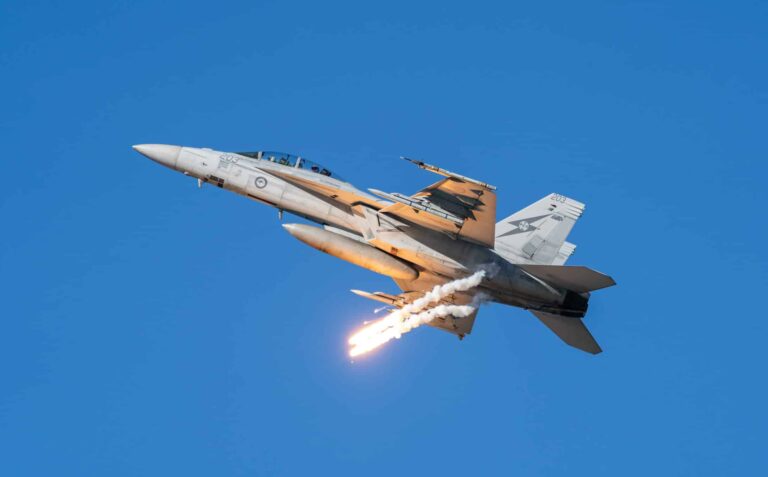 Fighter jet inblue sky firing