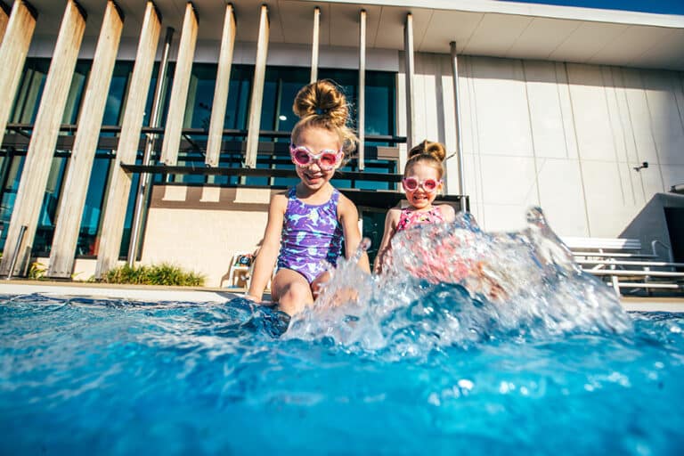 Aquatic centre fun for all ages as two girls splash